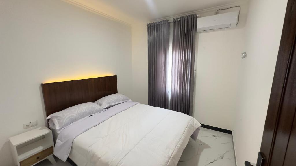Ένα ή περισσότερα κρεβάτια σε δωμάτιο στο Abram Homestay - For Family and Friends