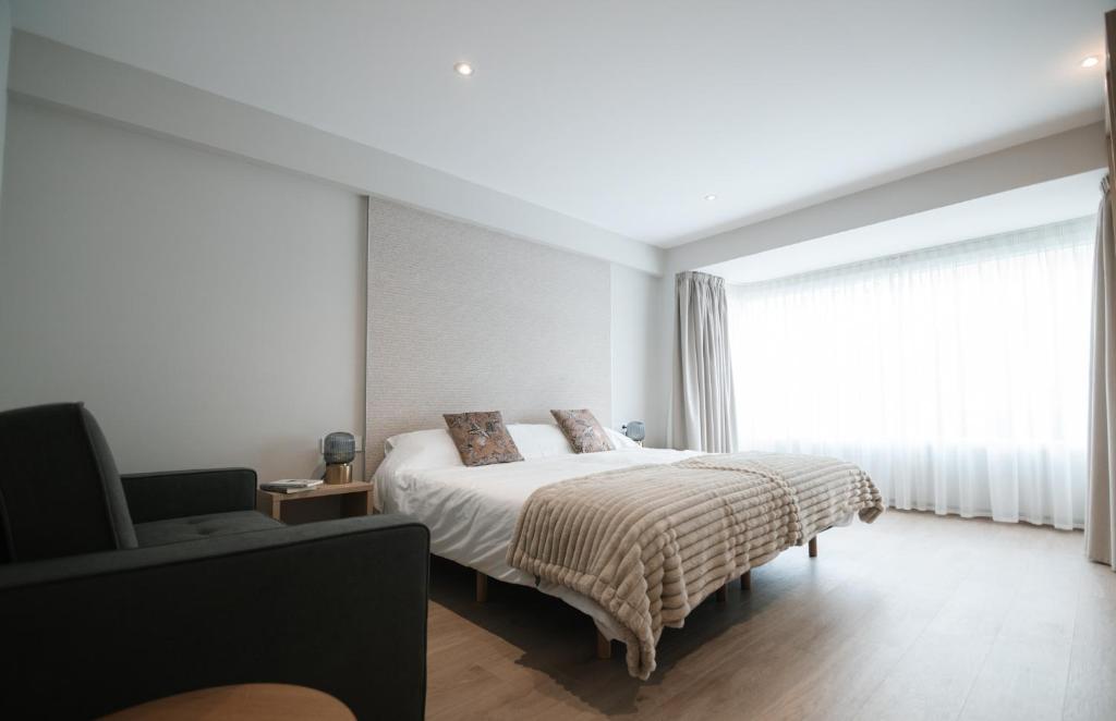 Ένα ή περισσότερα κρεβάτια σε δωμάτιο στο Suites Ermita 201