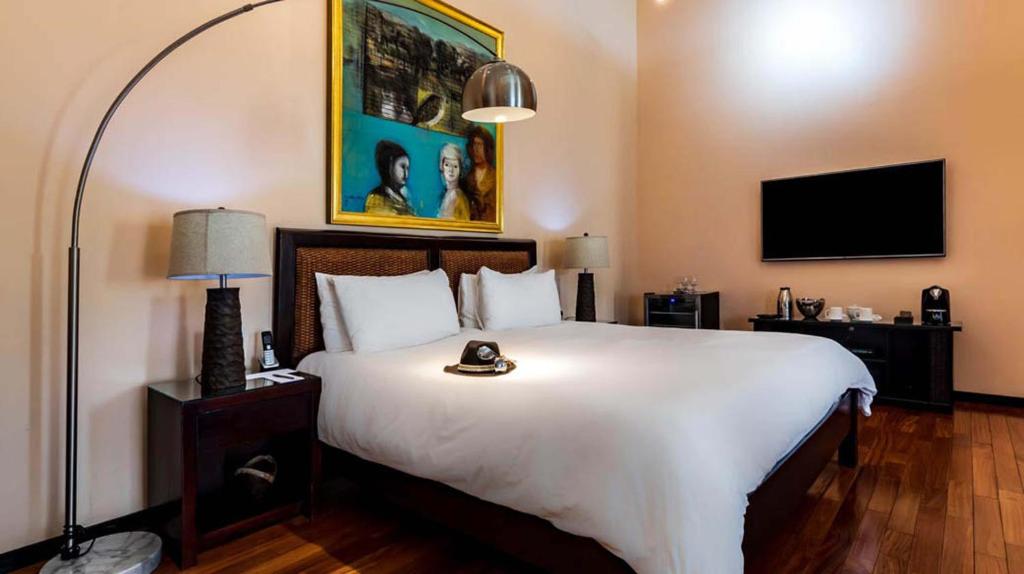 Postel nebo postele na pokoji v ubytování Gaia Collection Hotels Manuel Antonio
