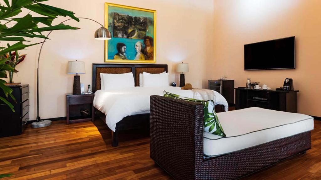 Postel nebo postele na pokoji v ubytování Gaia Collection Hotels Manuel Antonio