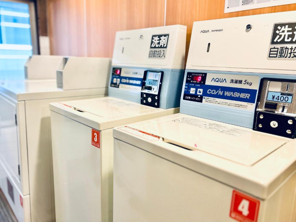 a group of machines sitting next to each other at Kadoya Hotel in Tokyo