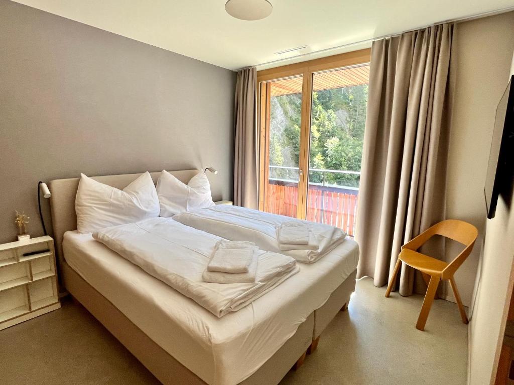 Postel nebo postele na pokoji v ubytování Ferienwohnung Stenna SELVA direkt bei Bergbahnen Skipiste