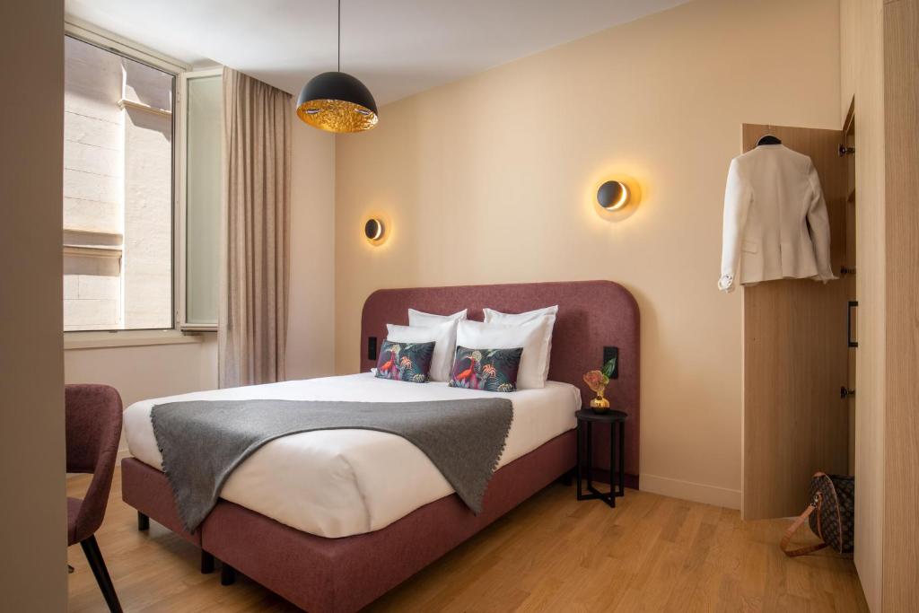 Postel nebo postele na pokoji v ubytování 9Hotel Cesari