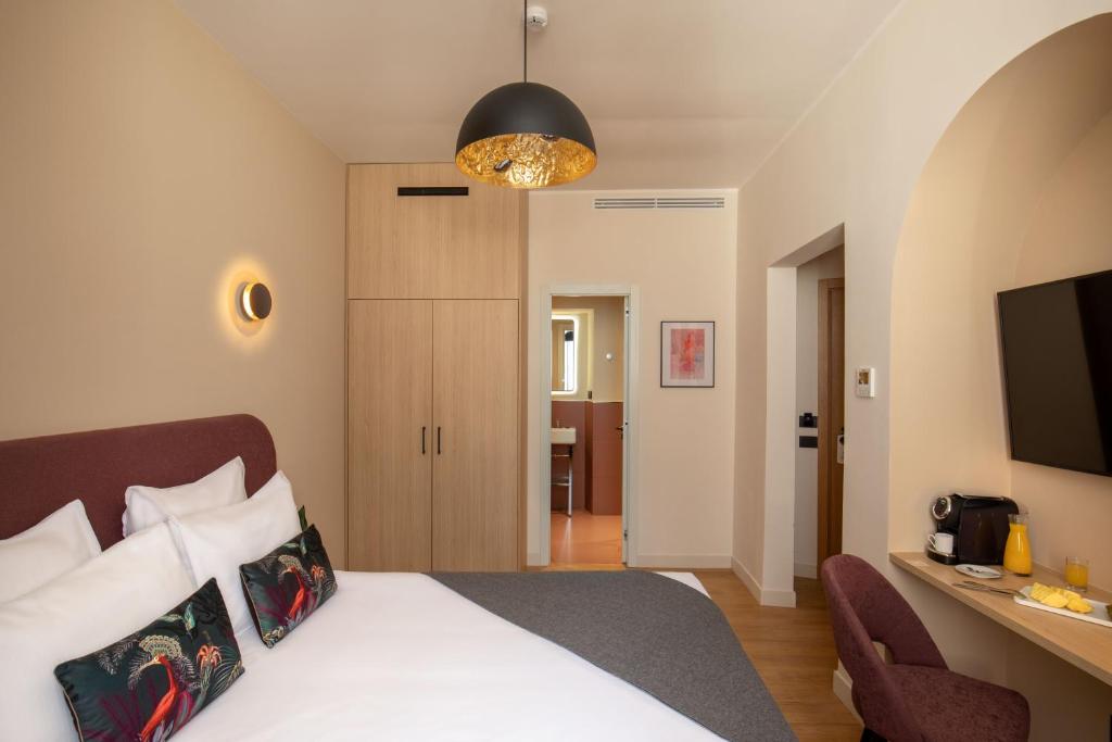 Postel nebo postele na pokoji v ubytování 9Hotel Cesari