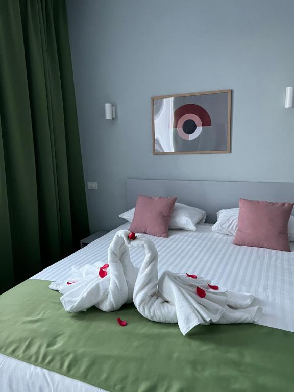 Postel nebo postele na pokoji v ubytování Astra Hotel