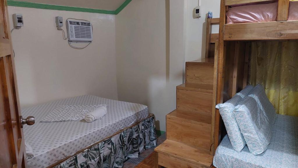 Postel nebo postele na pokoji v ubytování Mariden Resort & Homestay Siargao