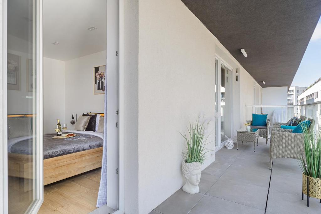 Posteľ alebo postele v izbe v ubytovaní Lumina lux apartment on Drewnowska