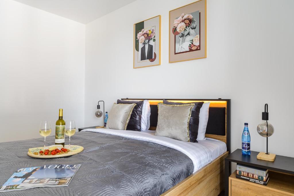 Posteľ alebo postele v izbe v ubytovaní Lumina lux apartment on Drewnowska