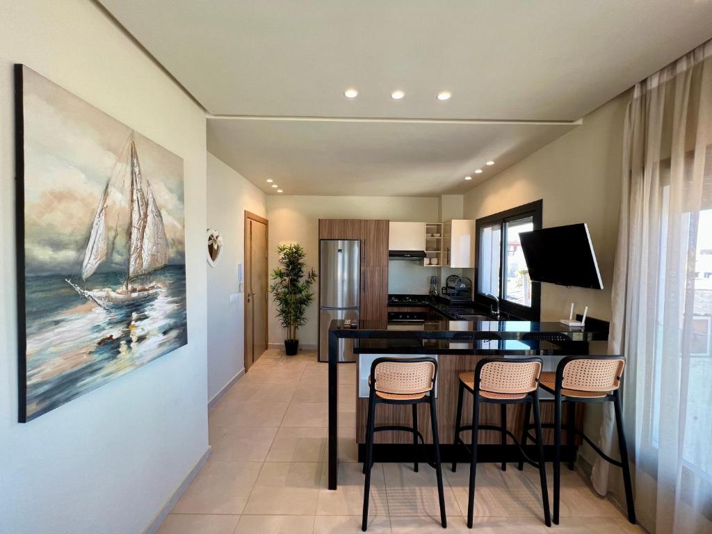 Kuchyň nebo kuchyňský kout v ubytování Seaside Apartments