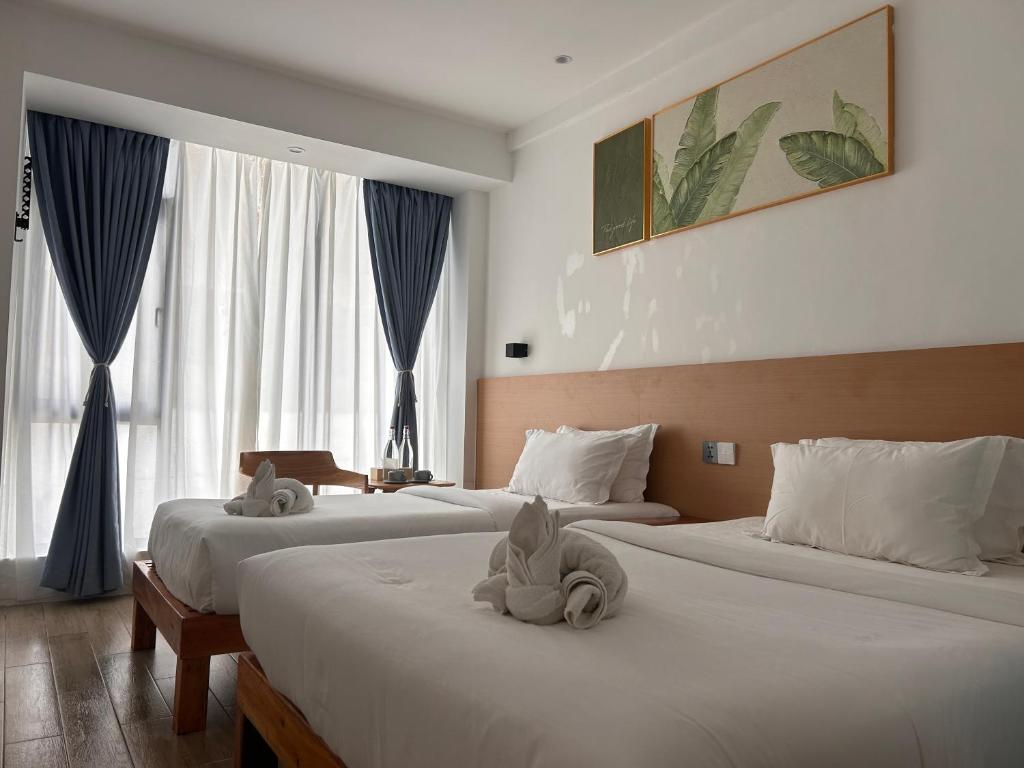 Postel nebo postele na pokoji v ubytování Fun Hotel