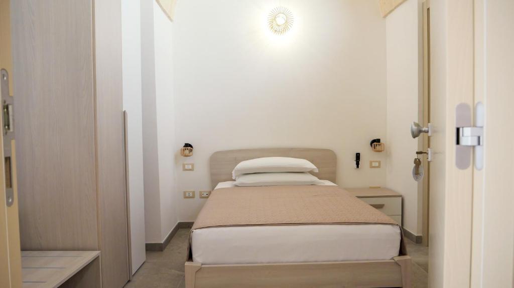 Postel nebo postele na pokoji v ubytování Perla Suite