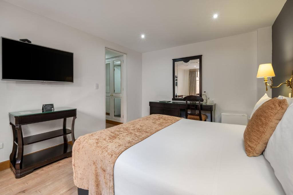 Postel nebo postele na pokoji v ubytování Hotel Le Manoir Bogotá
