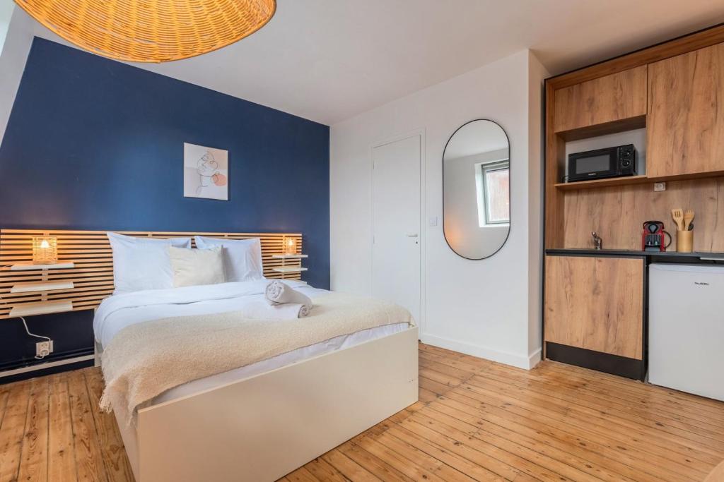 En eller flere senge i et værelse på Studio équipé proche centre-ville et métro