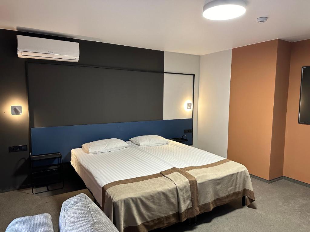 Postel nebo postele na pokoji v ubytování Campus Inspire Хмельницький