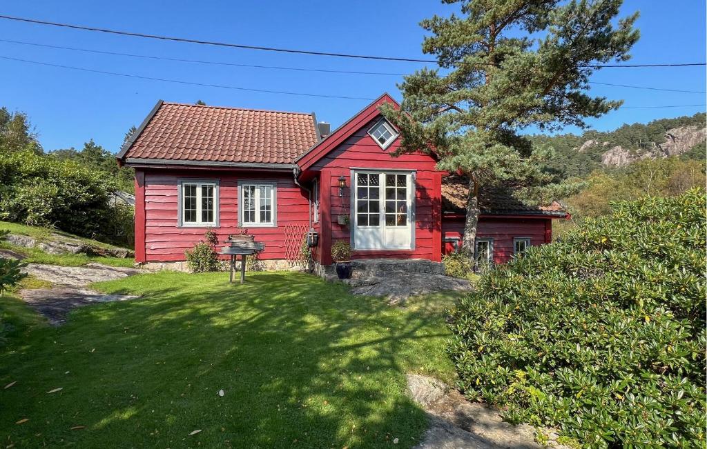 a red house with a red roof at 2 Bedroom Lovely Home In Lindesnes in Lonestranda