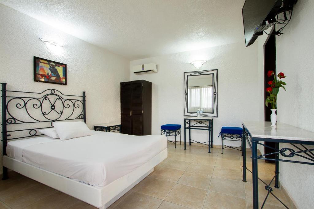 Postel nebo postele na pokoji v ubytování Hotel Bedd Express Querétaro