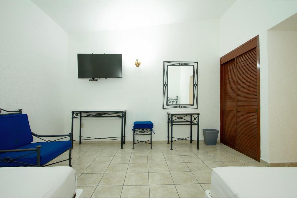 TV a/nebo společenská místnost v ubytování Hotel Bedd Express Querétaro