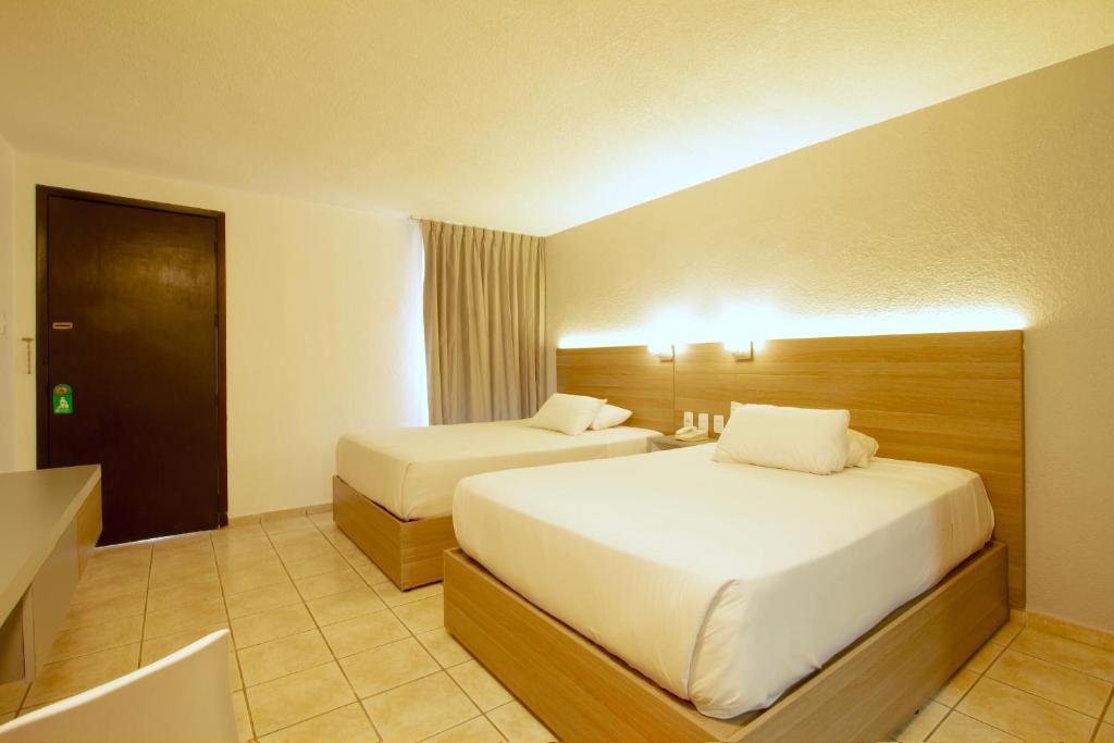 Postel nebo postele na pokoji v ubytování Hotel Bedd Express Querétaro