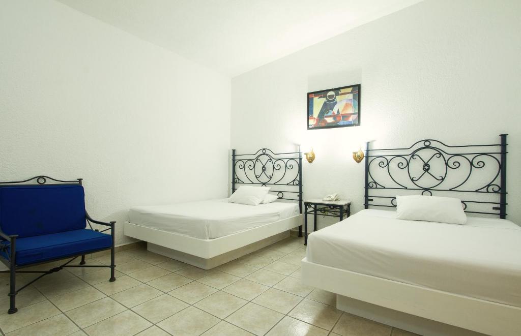 Postel nebo postele na pokoji v ubytování Hotel Bedd Express Querétaro