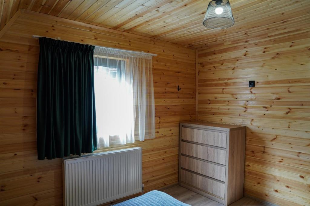 Postel nebo postele na pokoji v ubytování UnderHill Kazbegi