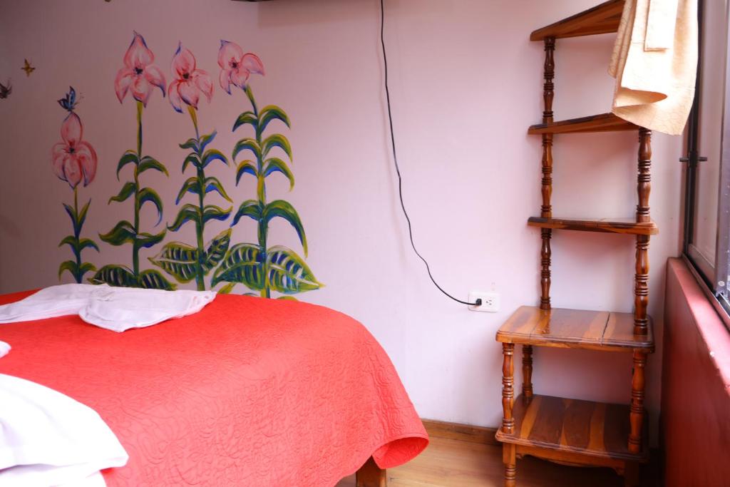 Postel nebo postele na pokoji v ubytování Andes Hostal