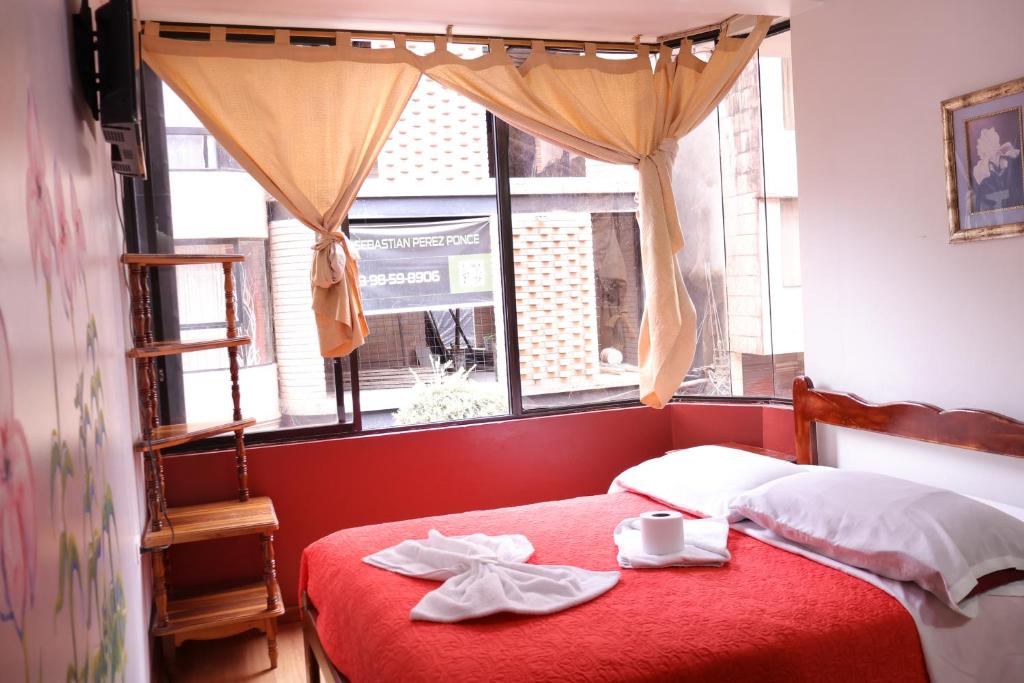 Postel nebo postele na pokoji v ubytování Andes Hostal