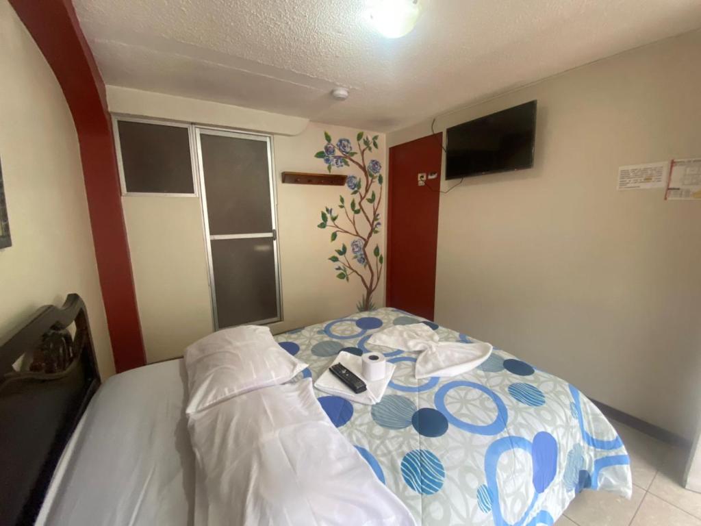 Postel nebo postele na pokoji v ubytování Andes Hostal