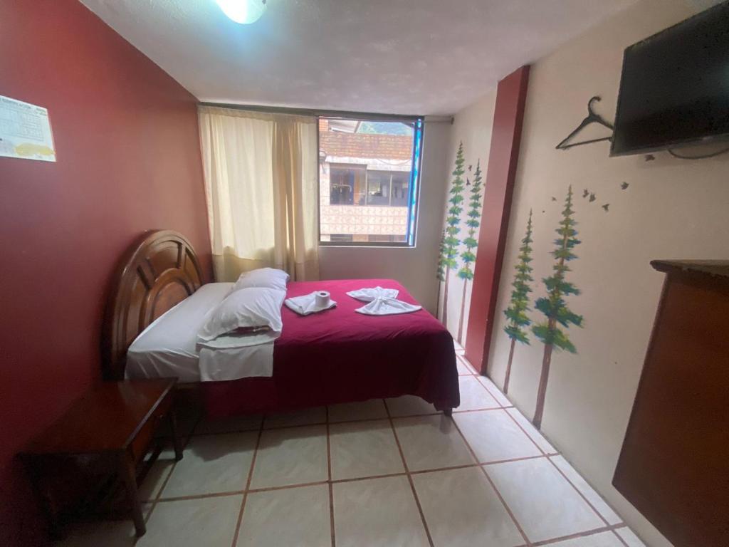 Postel nebo postele na pokoji v ubytování Andes Hostal