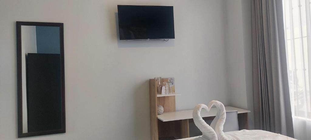 TV a/nebo společenská místnost v ubytování Hotel Luckys