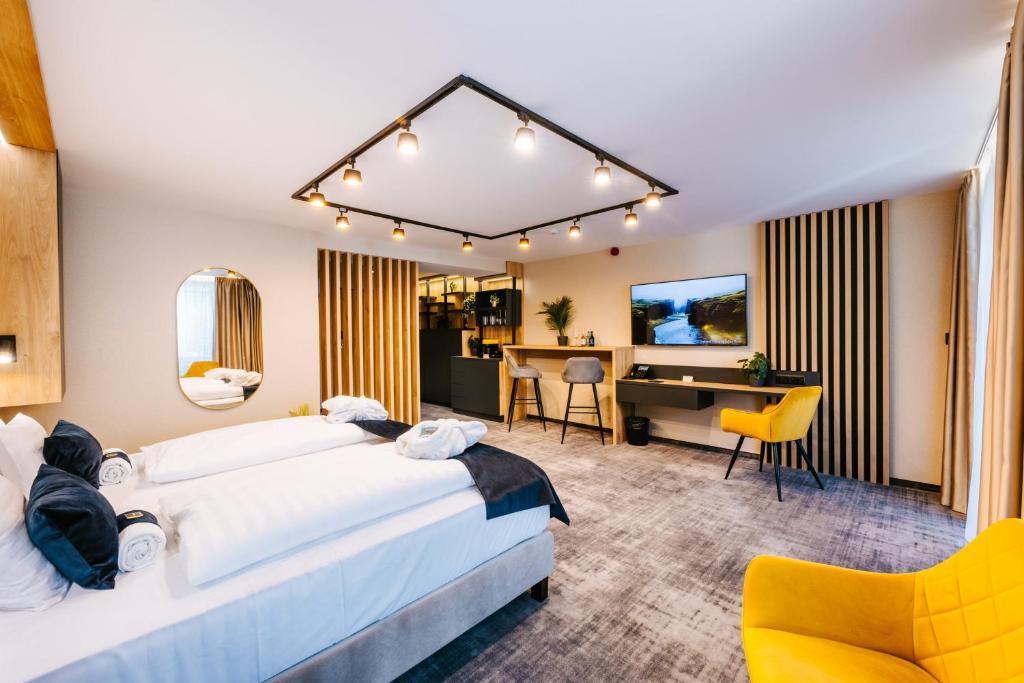 Postel nebo postele na pokoji v ubytování Hotel Auris