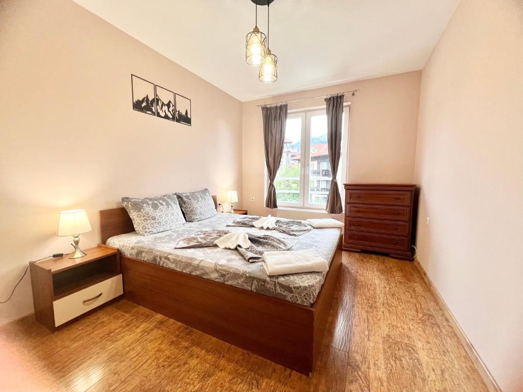 Postel nebo postele na pokoji v ubytování Bojurland Apartment, Bansko