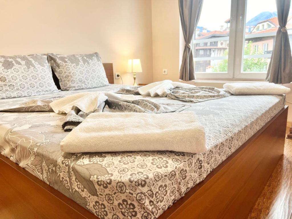 Postel nebo postele na pokoji v ubytování Bojurland Apartment, Bansko
