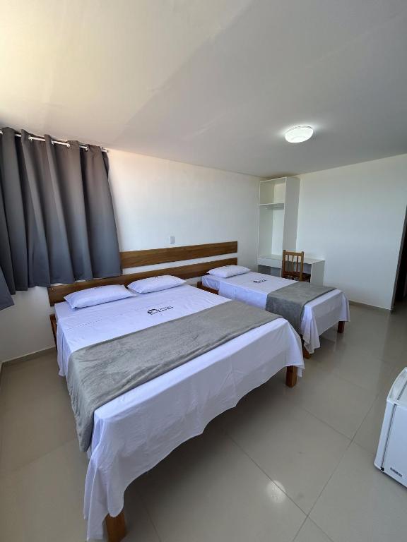 Postel nebo postele na pokoji v ubytování Hotel Beira do Rio