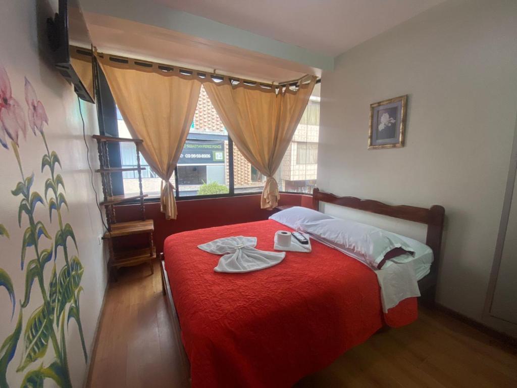 Postel nebo postele na pokoji v ubytování Andes Hostal