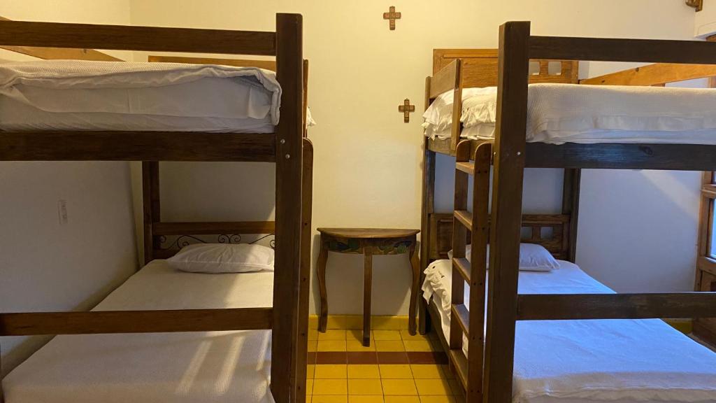 Postel nebo postele na pokoji v ubytování Hostal San Fransiskuni