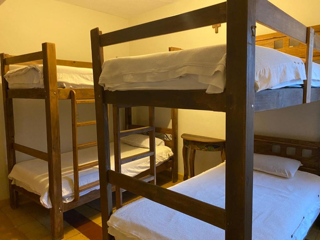 Postel nebo postele na pokoji v ubytování Hostal San Fransiskuni