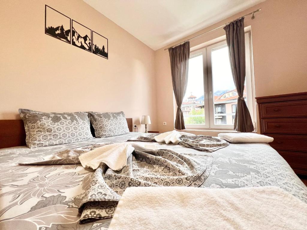 Postel nebo postele na pokoji v ubytování Bojurland Apartment, Bansko