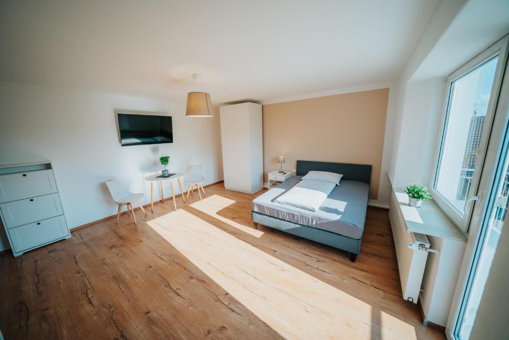 Posteľ alebo postele v izbe v ubytovaní Hotel Leo