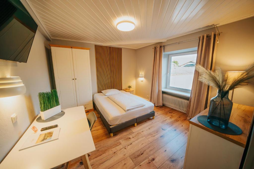 Posteľ alebo postele v izbe v ubytovaní Hotel Leo