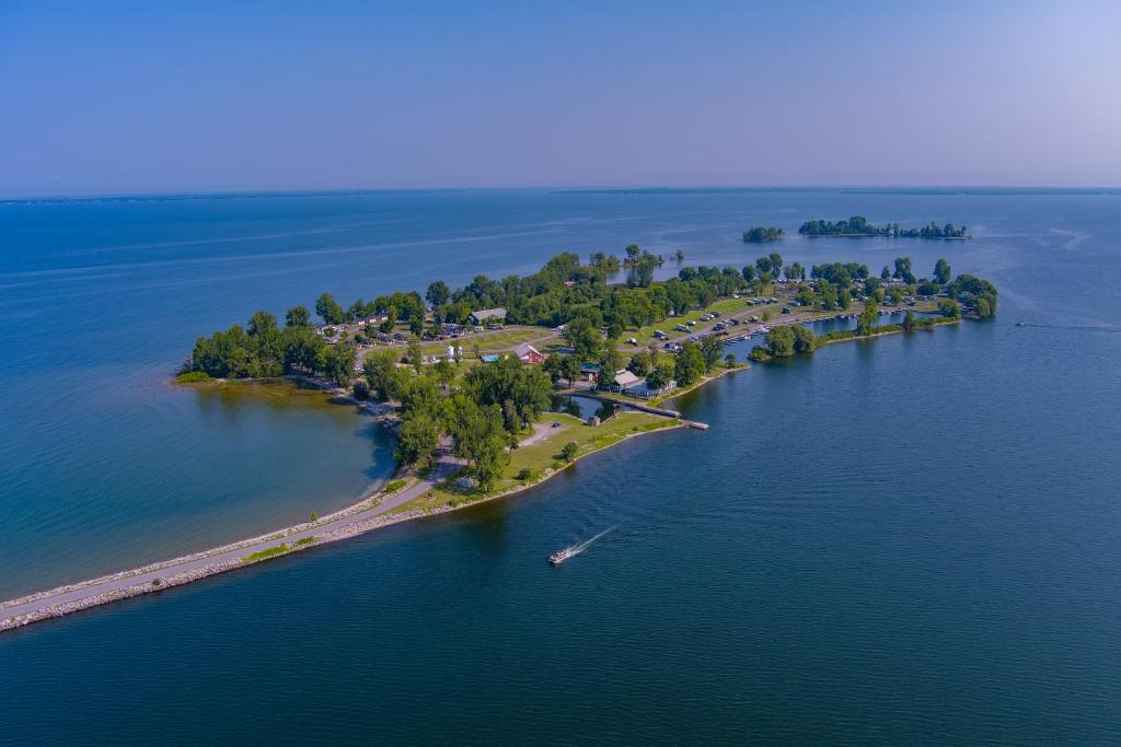 an island in the middle of a large body of water at Sun Outdoors Association Island in Henderson Harbor