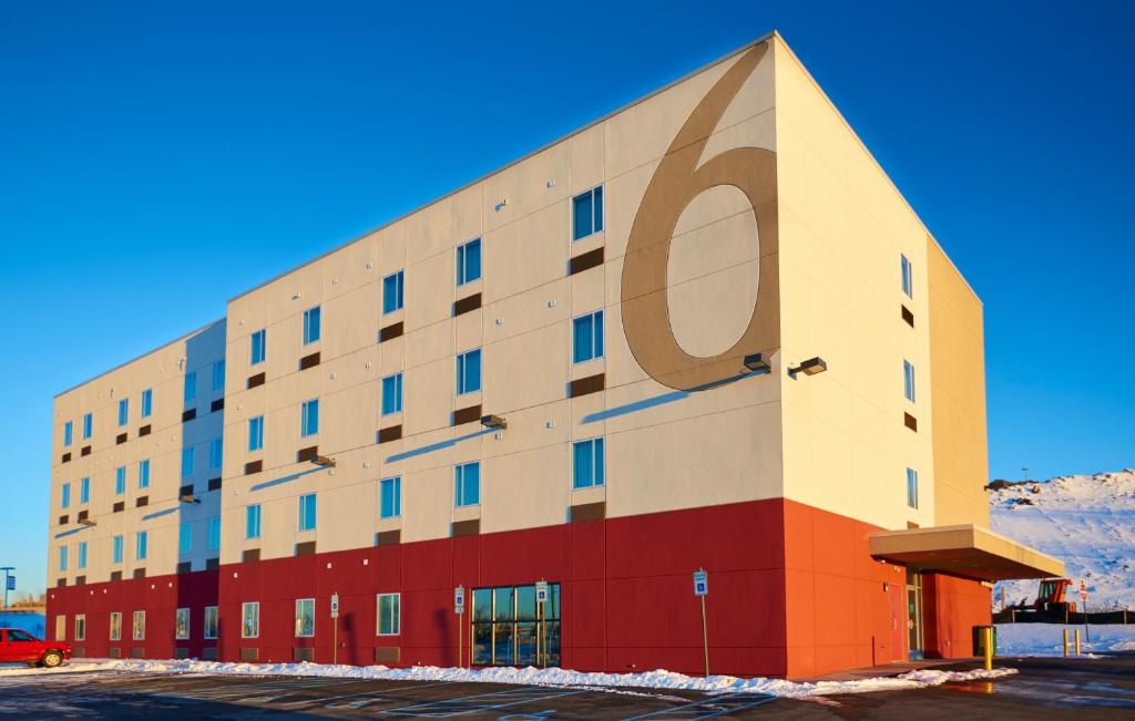 a building with a large p on the side of it at Motel 6 Wilkes Barre Arena in Wilkes-Barre