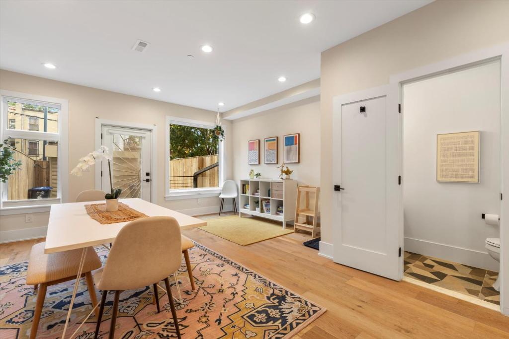 a dining room with a table and chairs at Central DC 5-BR Townhome - Walk to METRO-rail in Washington, D.C.