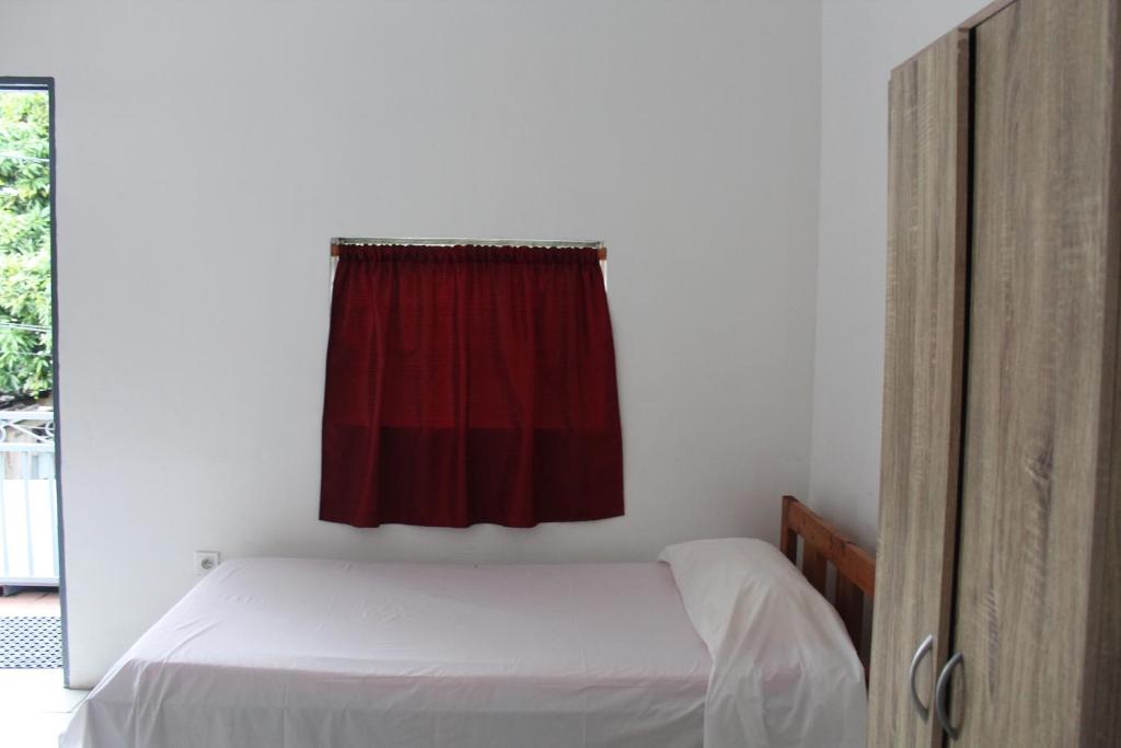 A bed or beds in a room at HIME LODGE