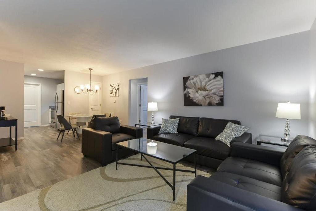 a living room with a couch and a table at Glam R Us - Pool - Fabulous Location Must Stay in Branson