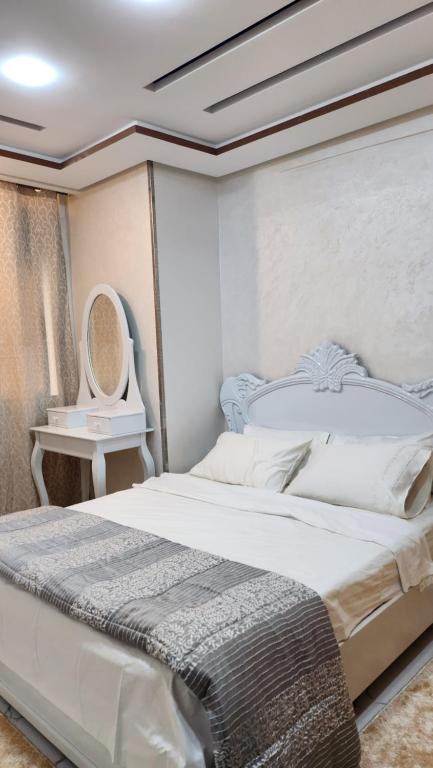 Ένα ή περισσότερα κρεβάτια σε δωμάτιο στο Appartement familial