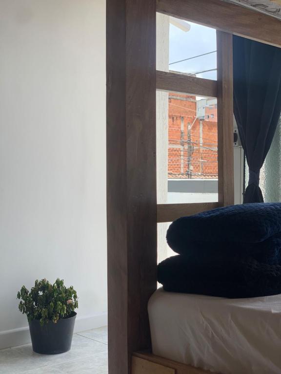 Postel nebo postele na pokoji v ubytování Hostal CasaBlanca, Laureles Estadio