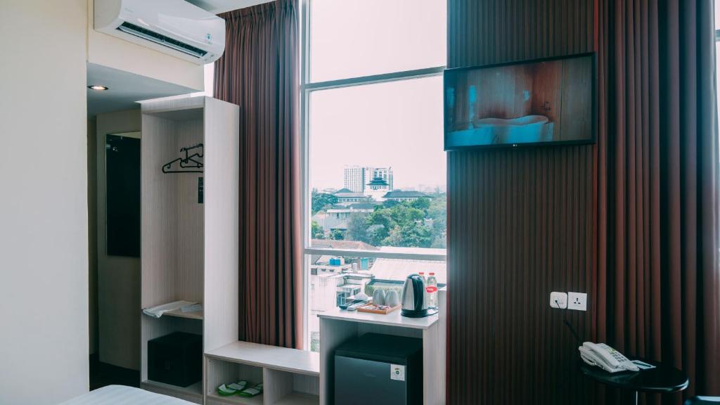 TV a/nebo společenská místnost v ubytování Tebu Hotel Bandung