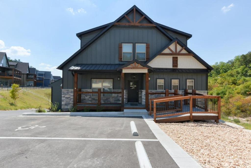a house with a parking lot in front of it at Journey's Remedy -Lake View Sleeps 30 in Branson