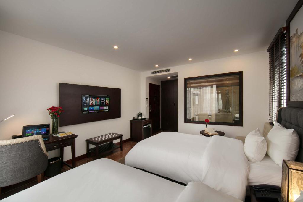 Postel nebo postele na pokoji v ubytování Bradi Gate- 22Land Residence Hotel