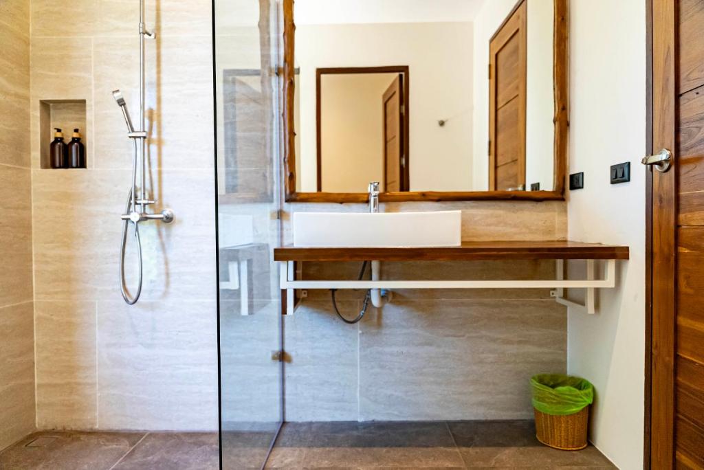 a bathroom with a sink and a shower at Mae Ya Resort in Ko Tao